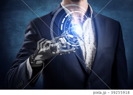 Businessman with robot hand touches virtual icon Businessman with robot hand touches virtual icon 39255918