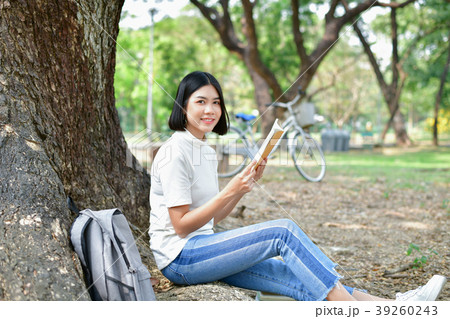 Education Concepts. Asian women reading books in the park. Beaut 39260243