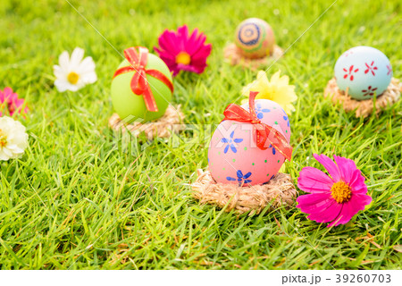 Closeup Colorful Easter eggs in nest Closeup Colorful Easter eggs in nest 39260703