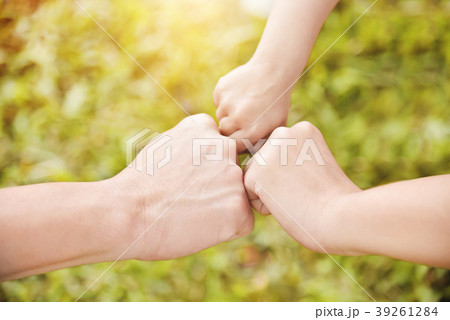 Family join hands  together. 39261284