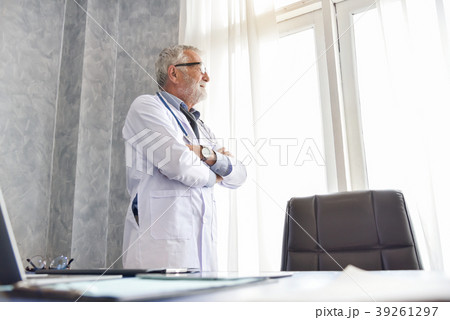 Senior male Doctor is thinking. Senior male Doctor is thinking. 39261297
