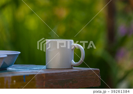 hot coffee on wooden table 39261384