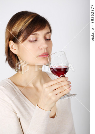 A woman tasting pink wine A woman tasting pink wine 39262377