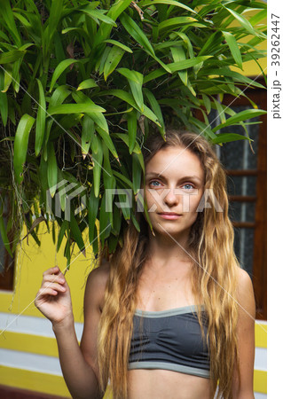 girl near a bush of orchids girl near a bush of orchids 39262447