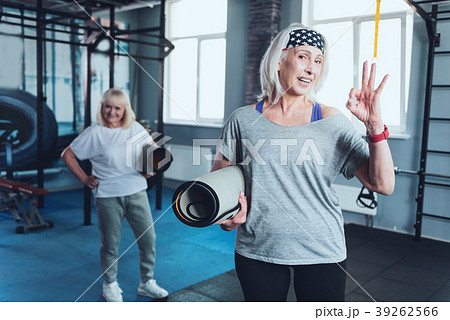 Positive senior woman gesturing ok sign at gym 39262566