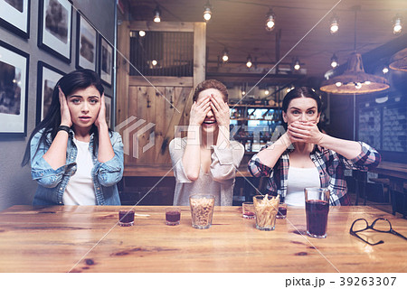 Delighted positive women playing a game Delighted positive women playing a game 39263307