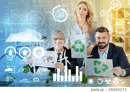 Experienced eco engineers sitting together and Experienced eco engineers sitting together and 39264273