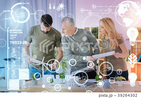 Serious engineers looking busy while working with 39264302