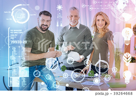 Positive emotional engineers smiling and looking 39264668