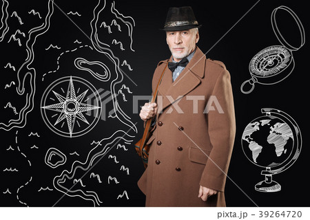 Calm man in brown coat looking confident before 39264720