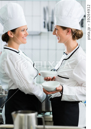 female chefs in commercial kitchen wearing white female chefs in commercial kitchen wearing white 39264912
