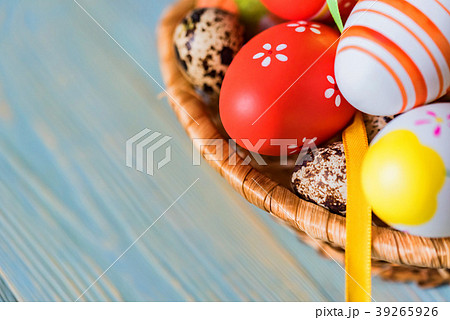 Several colorful Easter eggs in basket close 39265926