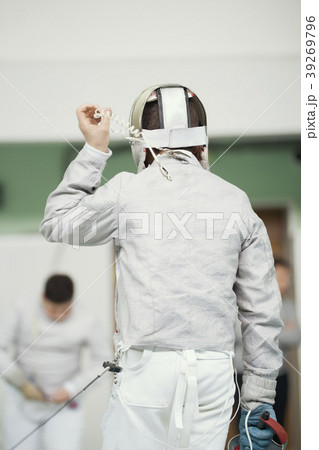 Back of young fencer in white costume and Back of young fencer in white costume and 39269796