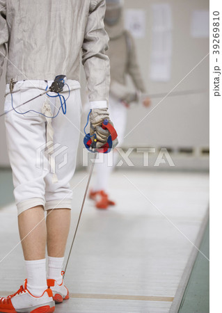 Rear view of teenage fencer in white clothes on 39269810