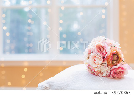 A rose bouquet in a bright interior room 39270863