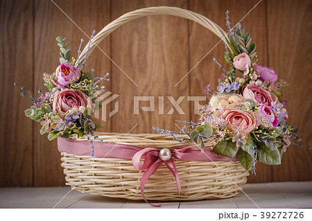 Decorative Easter basket with flowers Decorative Easter basket with flowers 39272726