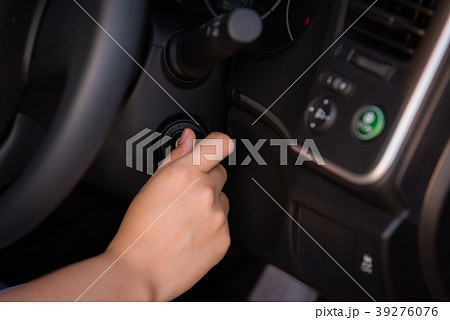 Close-up portrat of woman hand inserting key Close-up portrat of woman hand inserting key 39276076