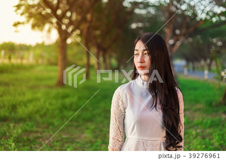 portrait of beautiful woman in park 39276961