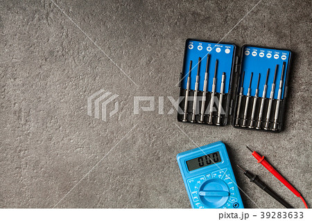 Digital multimeter on grey background 39283633