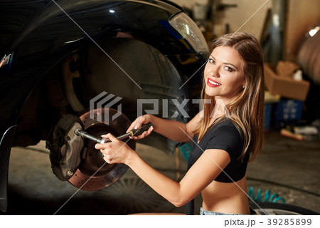 A closeup of girl with wrench in her hands 39285899