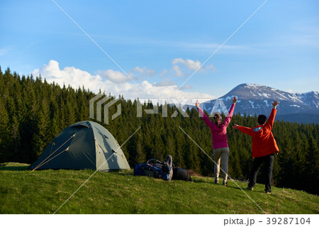 Female friends hiking together in the mountains Female friends hiking together in the mountains 39287104