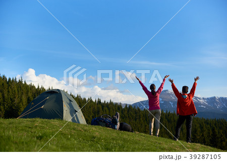 Female friends hiking together in the mountains Female friends hiking together in the mountains 39287105