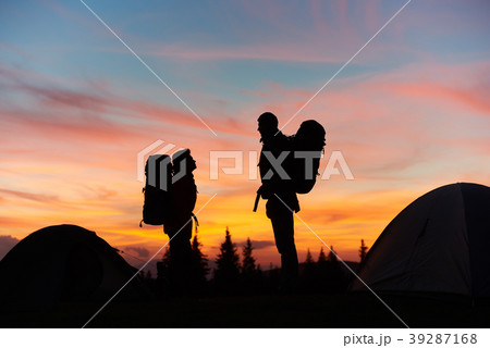 Couple hiking in the mountains together Couple hiking in the mountains together 39287168