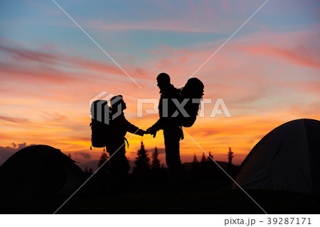 Couple hiking in the mountains together Couple hiking in the mountains together 39287171