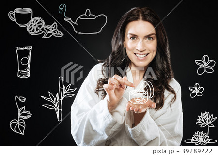 Young woman smiling and testing hew new facial Young woman smiling and testing hew new facial 39289222
