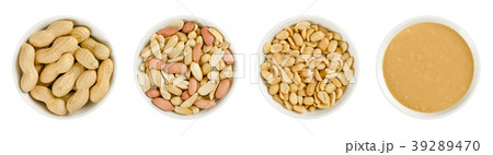 Peanuts in white porcelain bowls over white Peanuts in white porcelain bowls over white 39289470