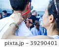 The artist draws a temporary tattoo on the guy's  39290401