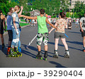 Young people in roller skates in the park  39290404
