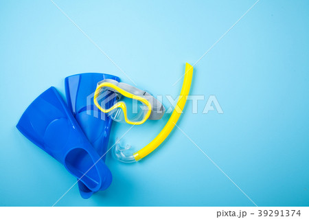 Blue flippers on color background 39291374