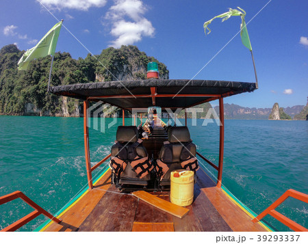 Tropical Thai jungle lake Cheo lan wood boat, wild Tropical Thai jungle lake Cheo lan wood boat, wild 39293337