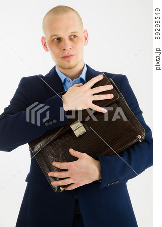 Handsome caucasian man in suit holding briefcase Handsome caucasian man in suit holding briefcase 39293549