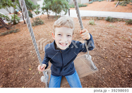 kid at swings 39298693