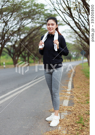 young sporty woman with white towel resting after workout sport 39300800