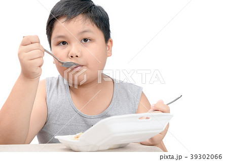 Obese fat boy eating fried rice in foam box Obese fat boy eating fried rice in foam box 39302066