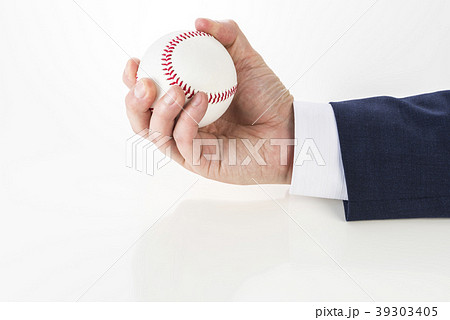 野球ボールを持ったビジネスマンの写真素材