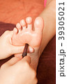 reflexology foot massage by wood stick 39305021