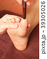 reflexology foot massage by wood stick 39305026