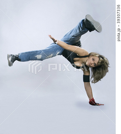 Teenage girl dancing breakdance in action 39307336