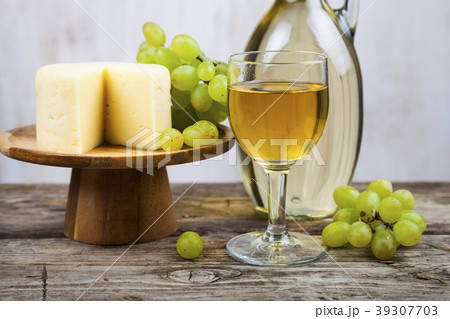 White wine, cheese and grapes 39307703