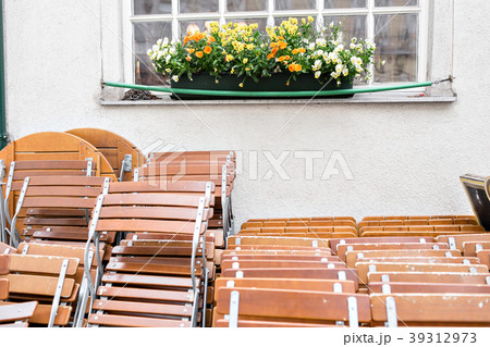 Street city cafe. Tables and Chairs neatly stacked Street city cafe. Tables and Chairs neatly stacked 39312973