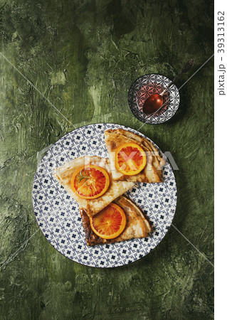 Pancakes with bloody oranges 39313162