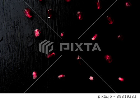 Delicious pomegranate fruit on black background 39319233