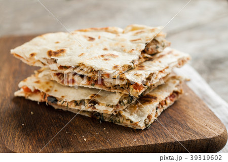 pile of quesadillas with chicken and vegetables pile of quesadillas with chicken and vegetables 39319602