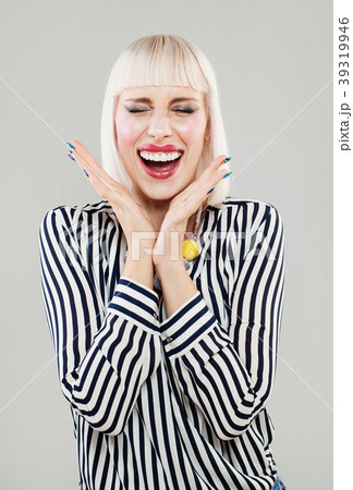 Excited Woman holds cheeks by hand Excited Woman holds cheeks by hand 39319946