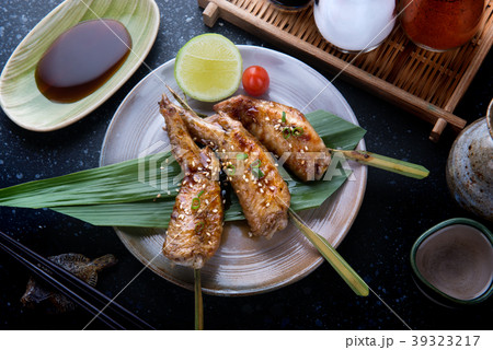 Grilled chicken wings with teriyaki sauce. Grilled chicken wings with teriyaki sauce. 39323217
