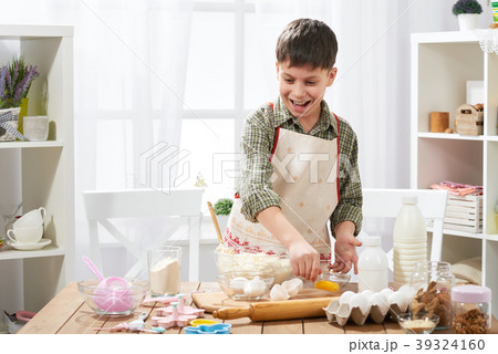 Boy cooking at home, making dough, buns and cookie 39324160